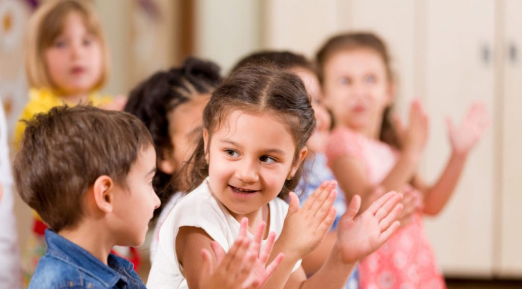 Preschool childs playing in classroom.